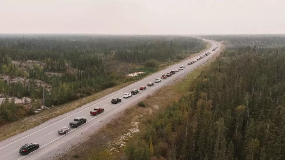 Cars evacuating Canadian city because of forest fire